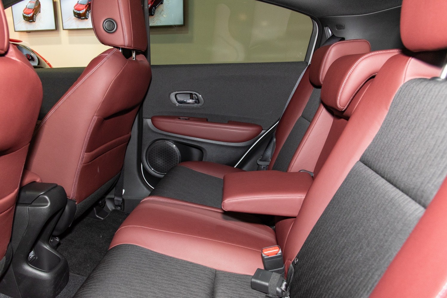 Dual-tone rear seats with fold-down armrest in a compact SUV interior