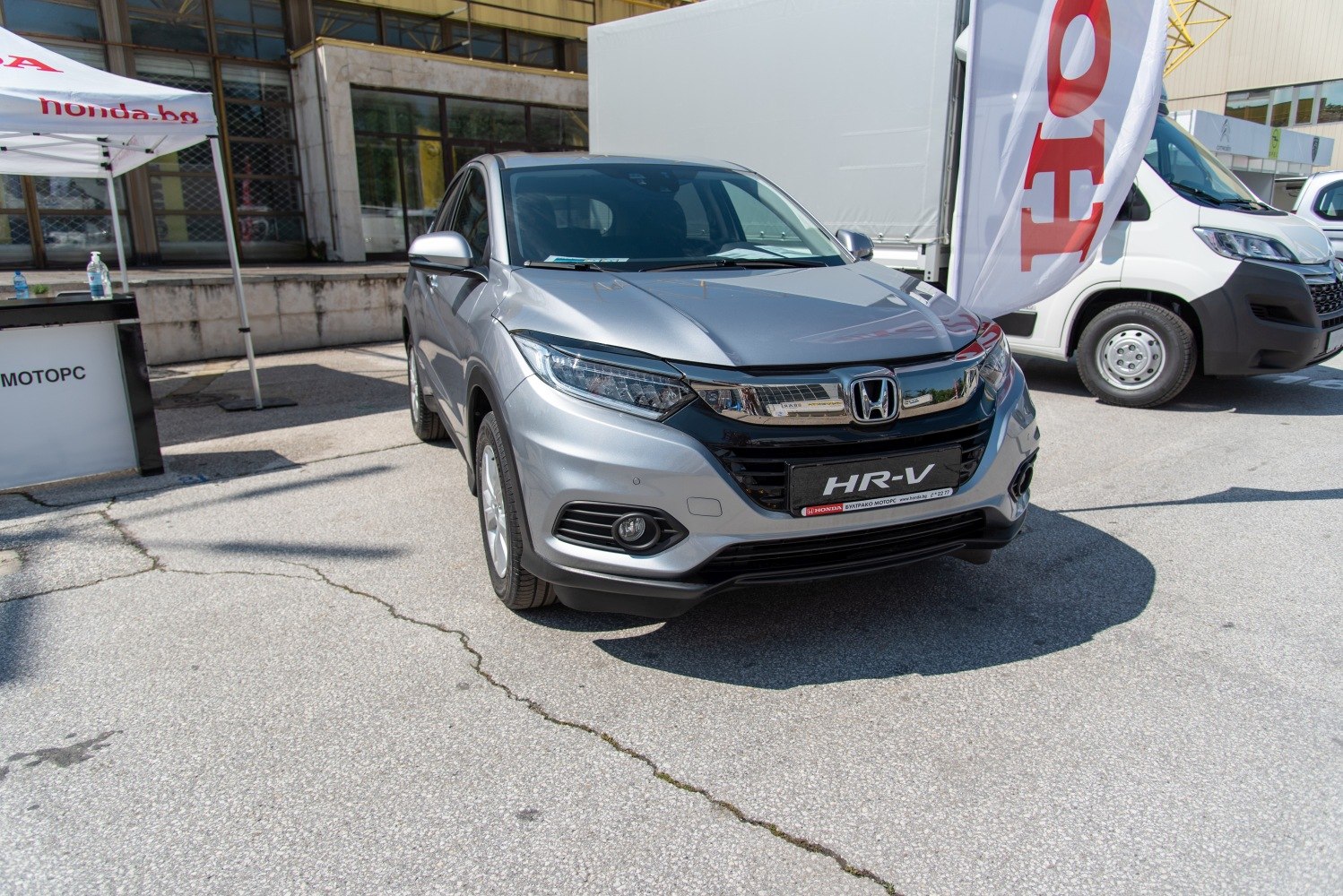 Front angle of a compact SUV with LED headlights and chrome grille
