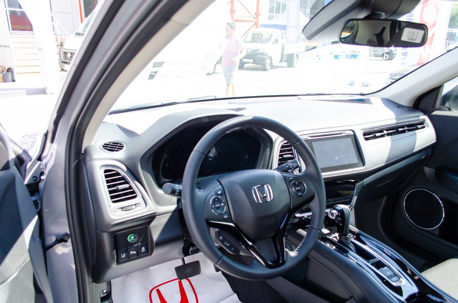 Modern dashboard and multifunction steering wheel inside a vehicle
