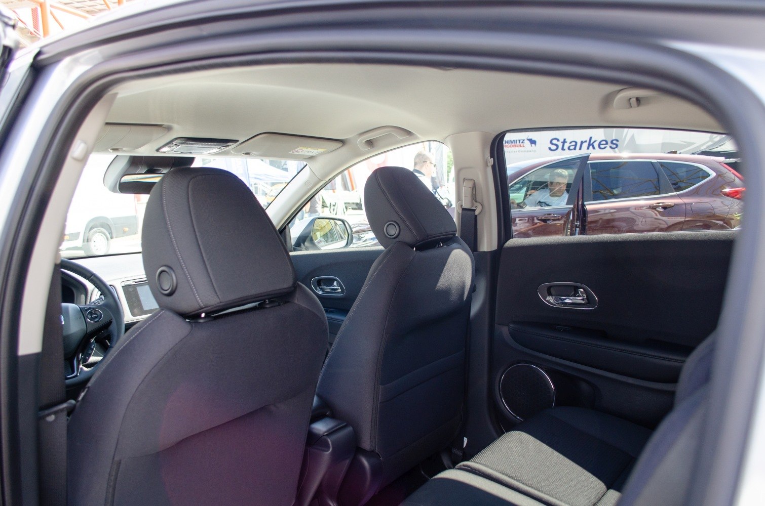 Rear seats and door panel with speaker and upholstery details