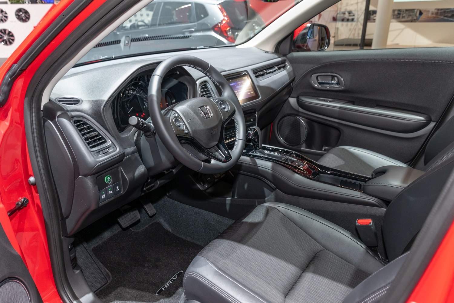 Modern interior with dashboard, steering wheel, and front seats