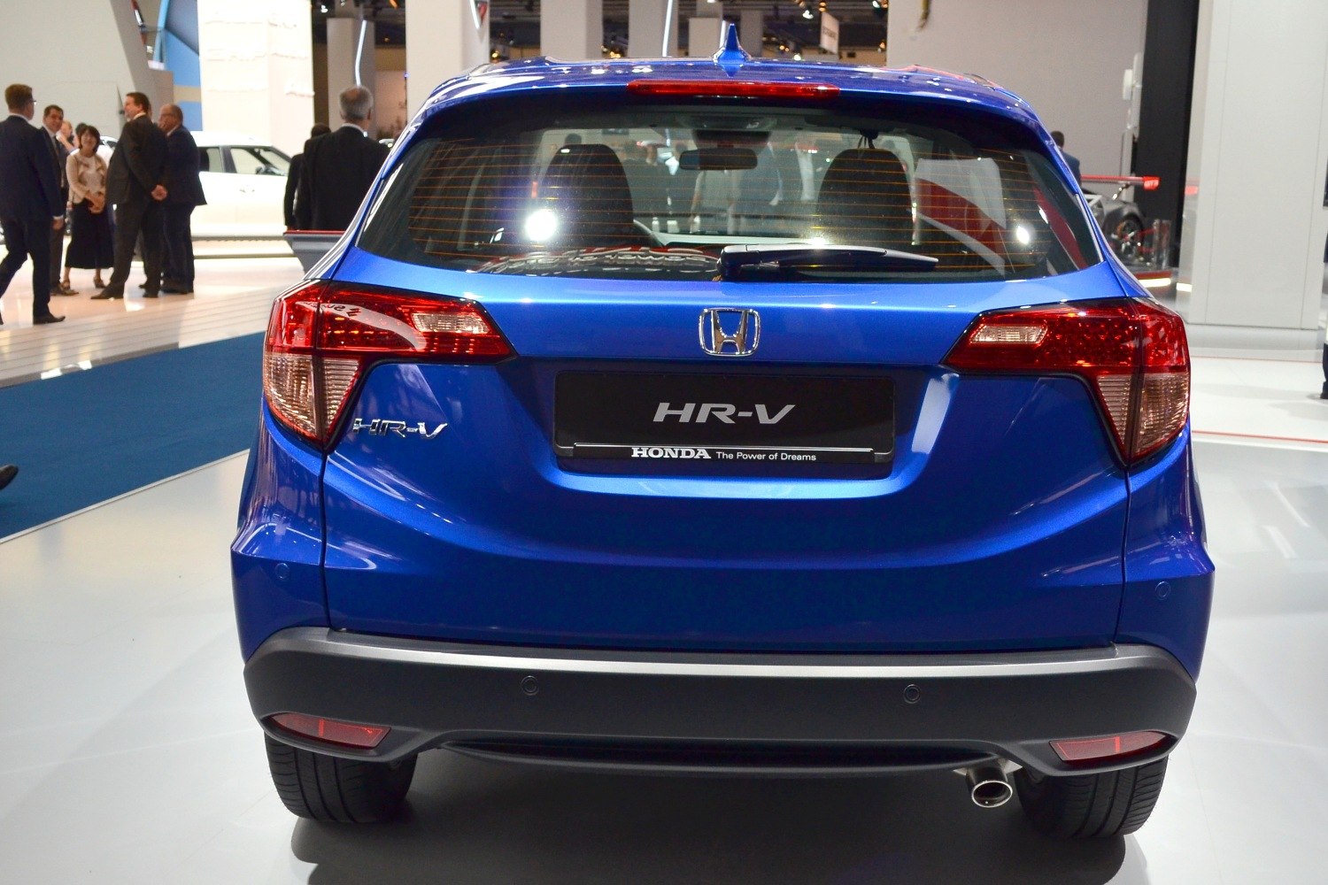 Rear view of blue compact SUV with taillights and rear bumper