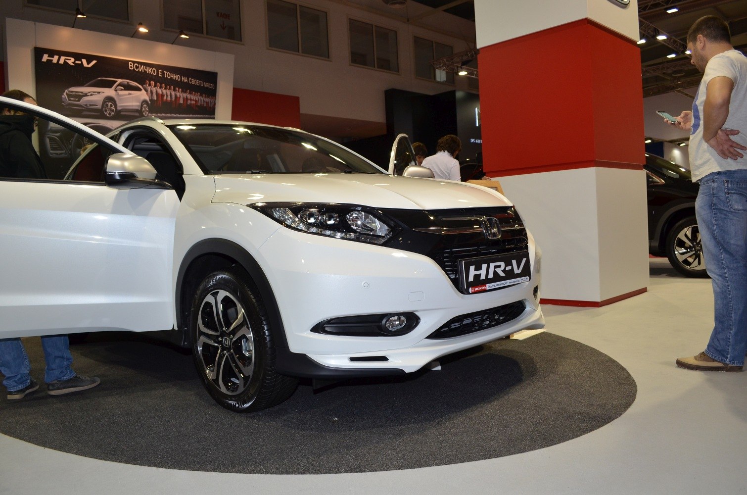 Front view of white compact SUV with alloy wheels and headlights.