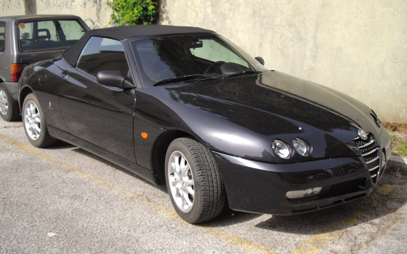 Convertible with dual round headlights and soft top roof