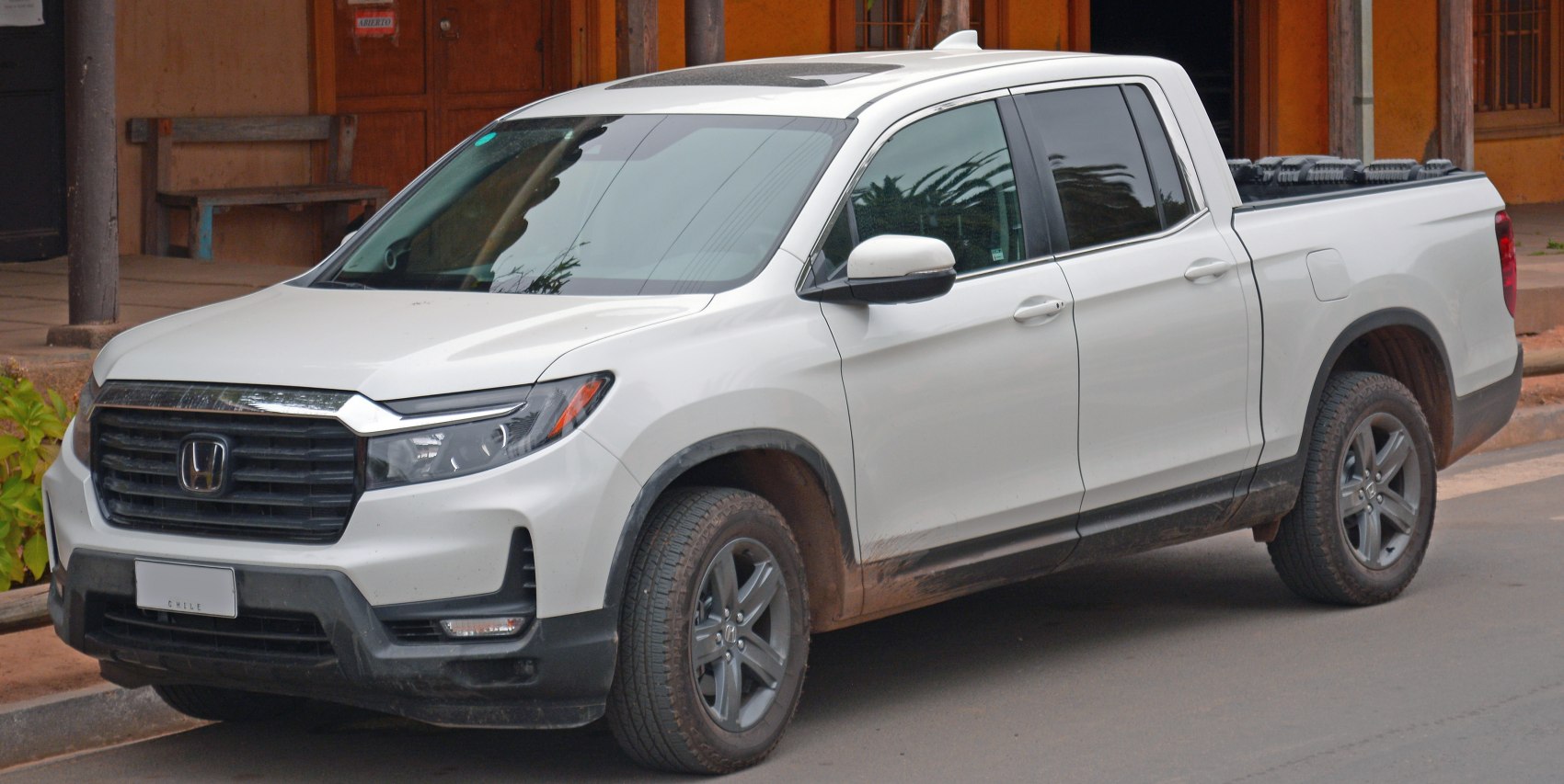 Front-side view with grille and headlights of a pickup truck