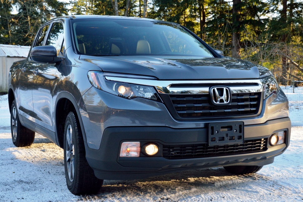 Front view of mid-size pickup with LED headlights and LED fog lights