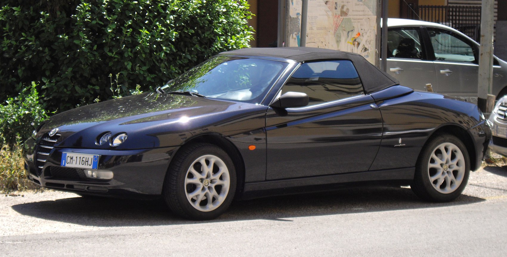 Convertible with soft top and distinctive triple front headlights
