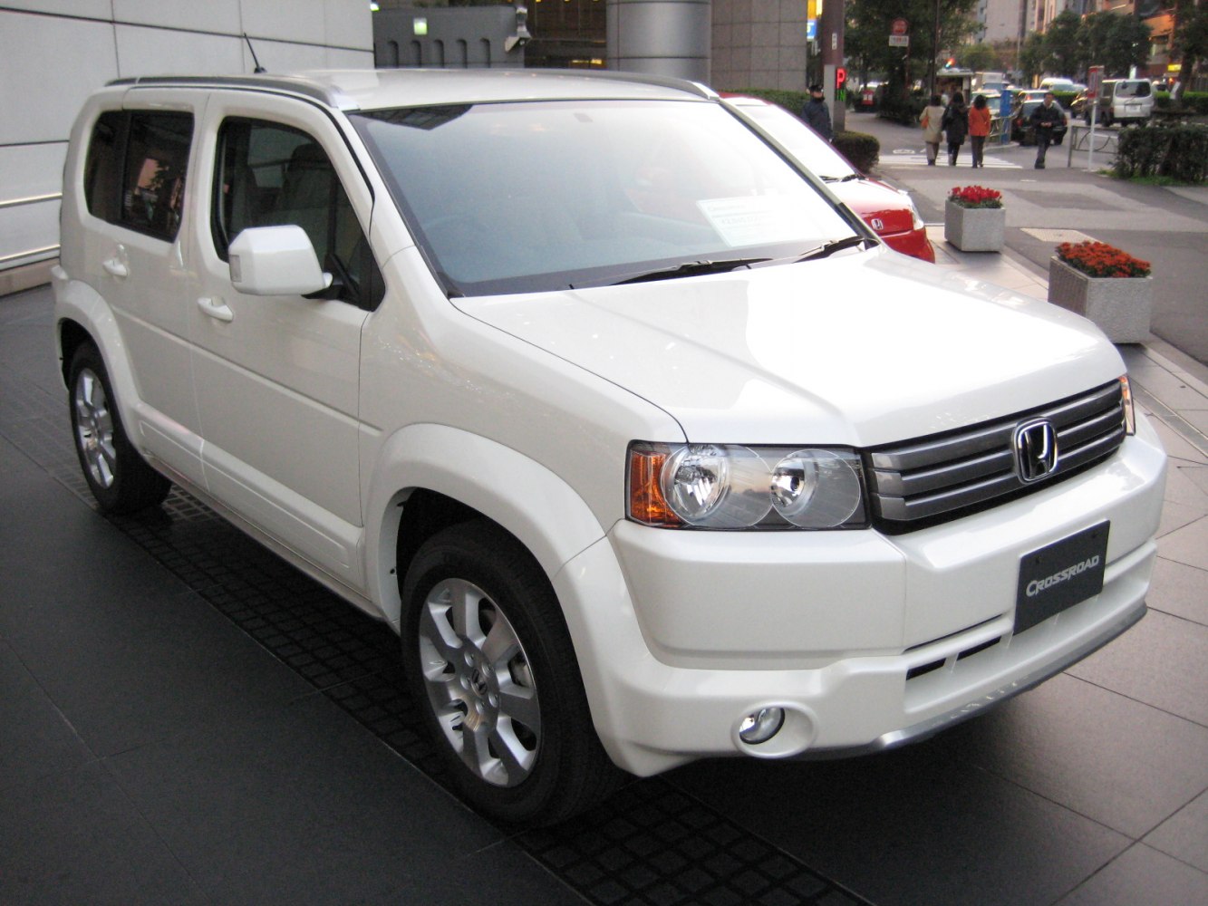 Boxy SUV with chrome grille, dual headlights, and fog lamps