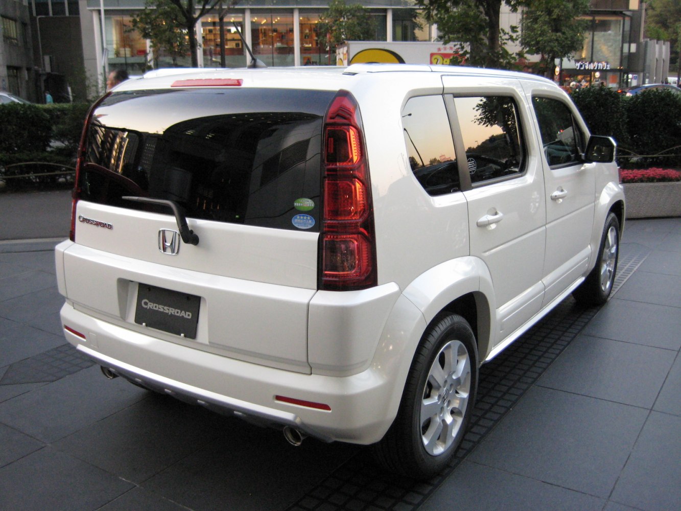 Rear and side view of compact SUV with tall vertical taillights and tinted windows