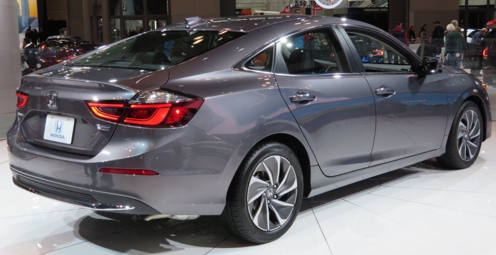 Rear and side view of a sedan with LED taillights and alloy wheels.