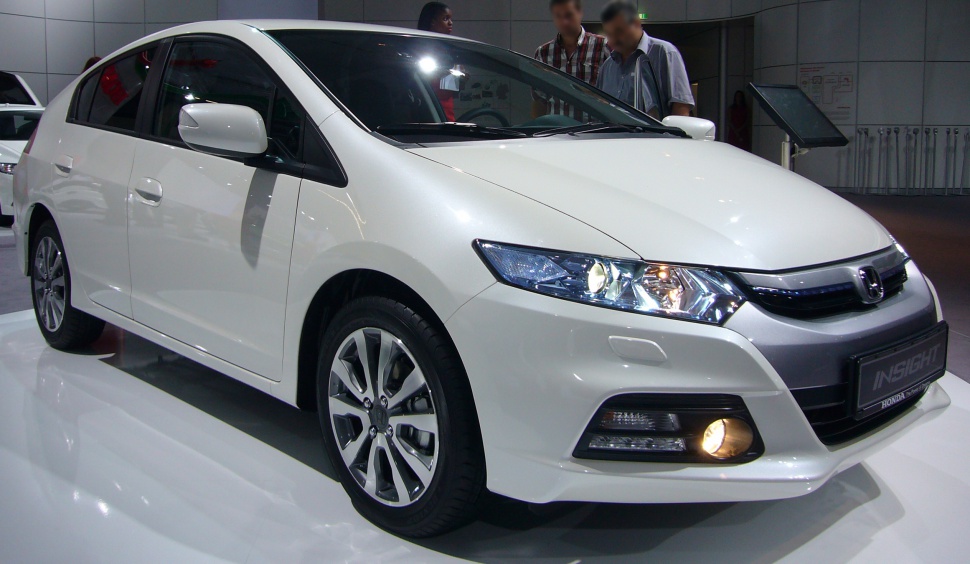 White sedan with LED headlights and alloy wheels