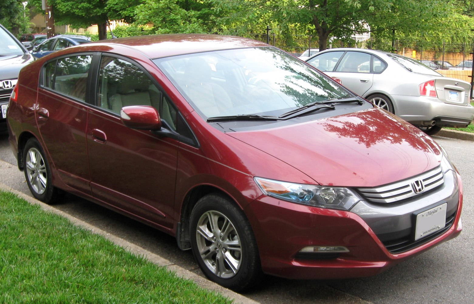 Aerodynamic hybrid hatchback with alloy wheels and integrated headlights