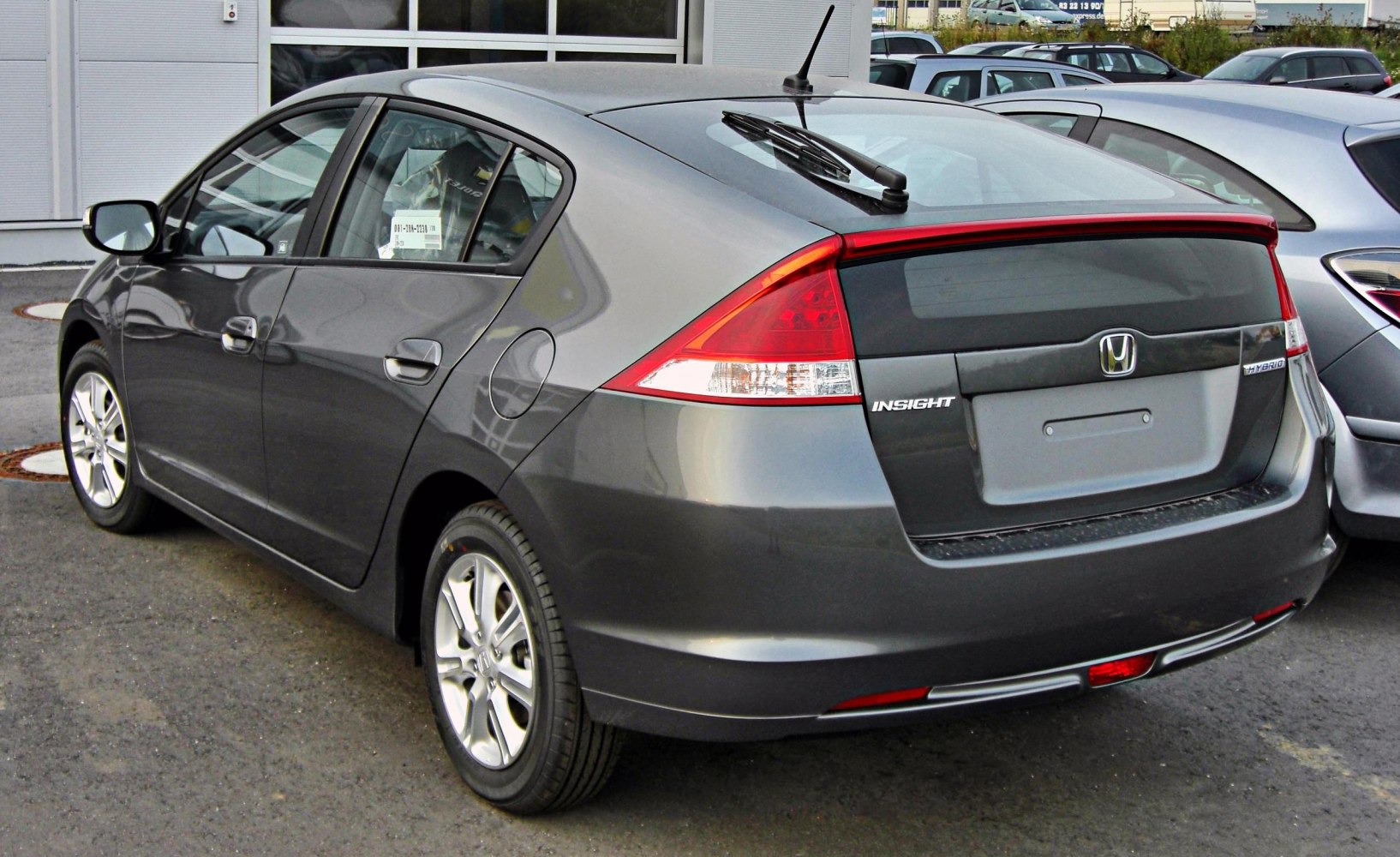 Rear and side view of hybrid hatchback with aerodynamic design