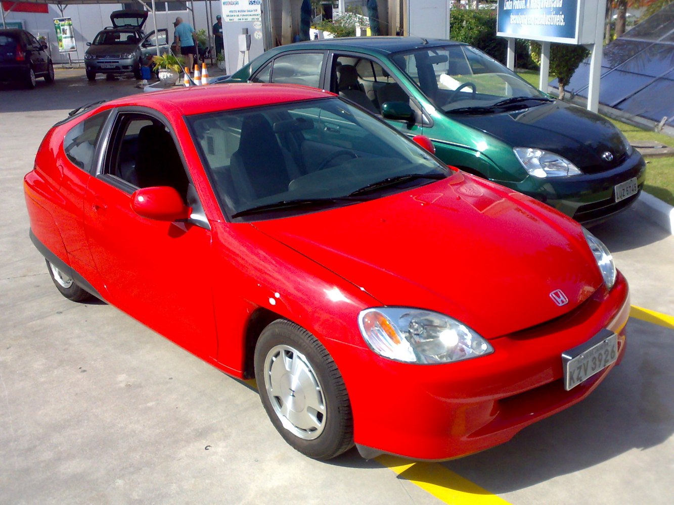 Aerodynamic hatchback with smooth body panels and covered rear wheels
