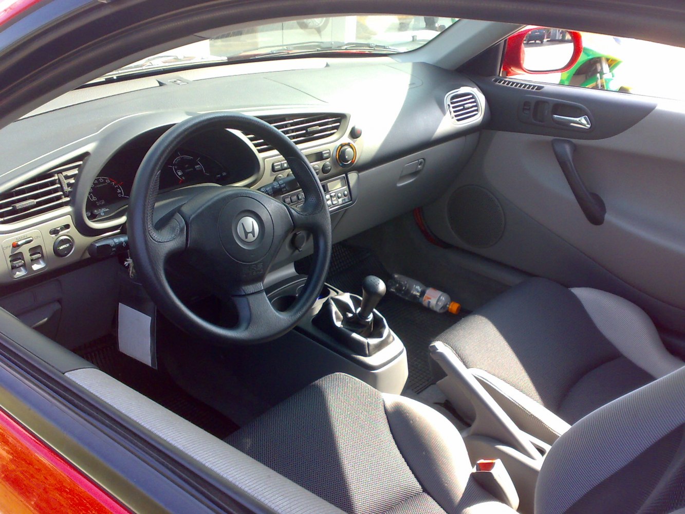 Steering wheel, manual gear stick, dashboard interior
