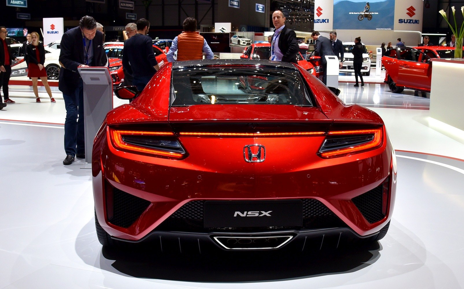 Rear view of a sporty car with LED tail lights and aerodynamic features