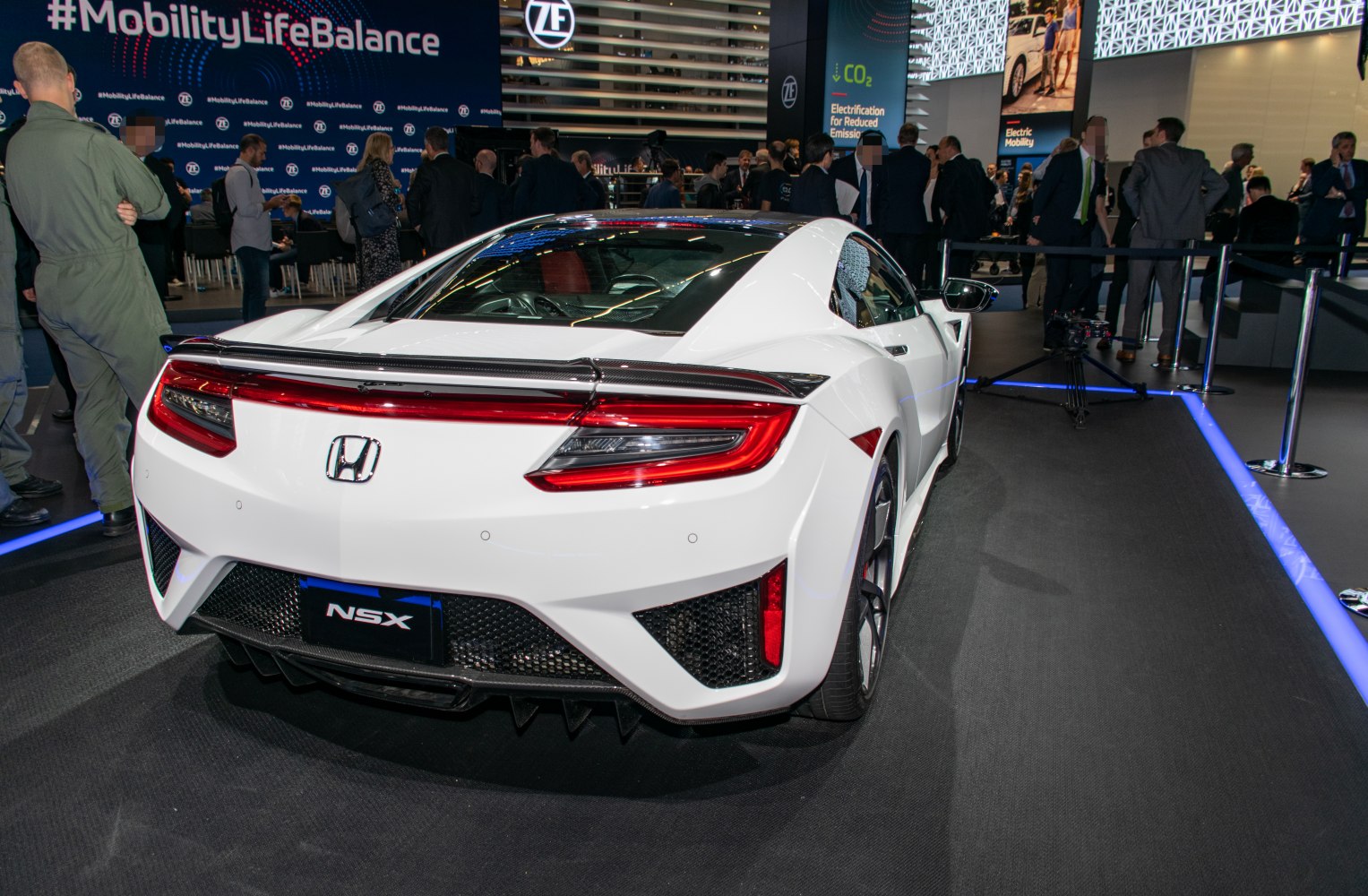 Sharp tail lights, carbon fiber spoiler, aggressive rear diffuser