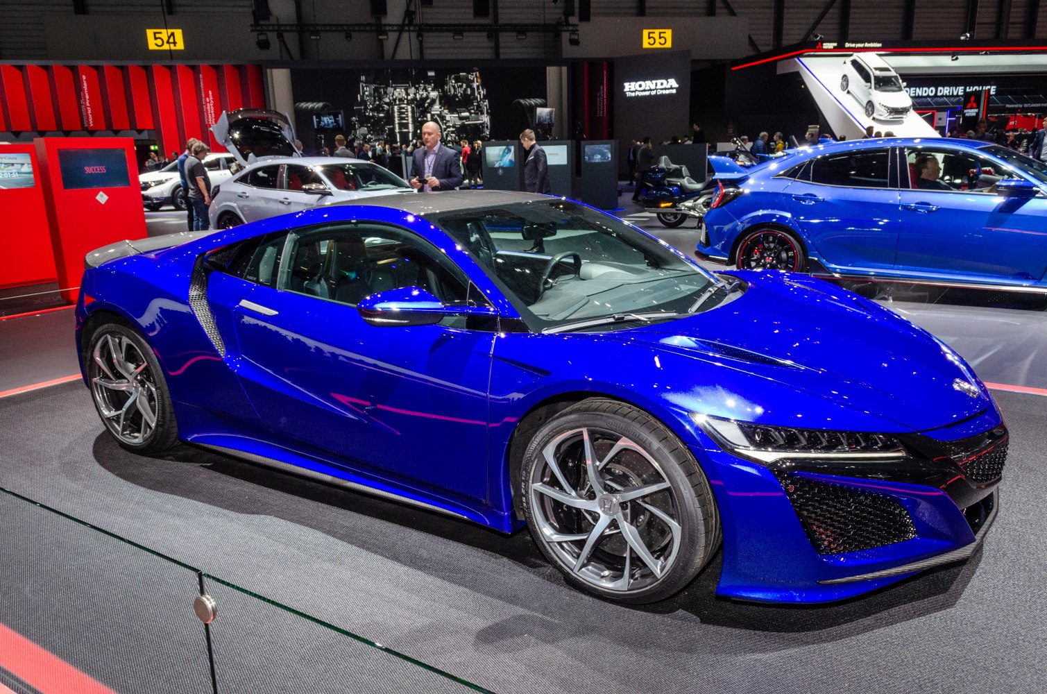 Blue sports coupe with LED headlights and multi-spoke alloy wheels