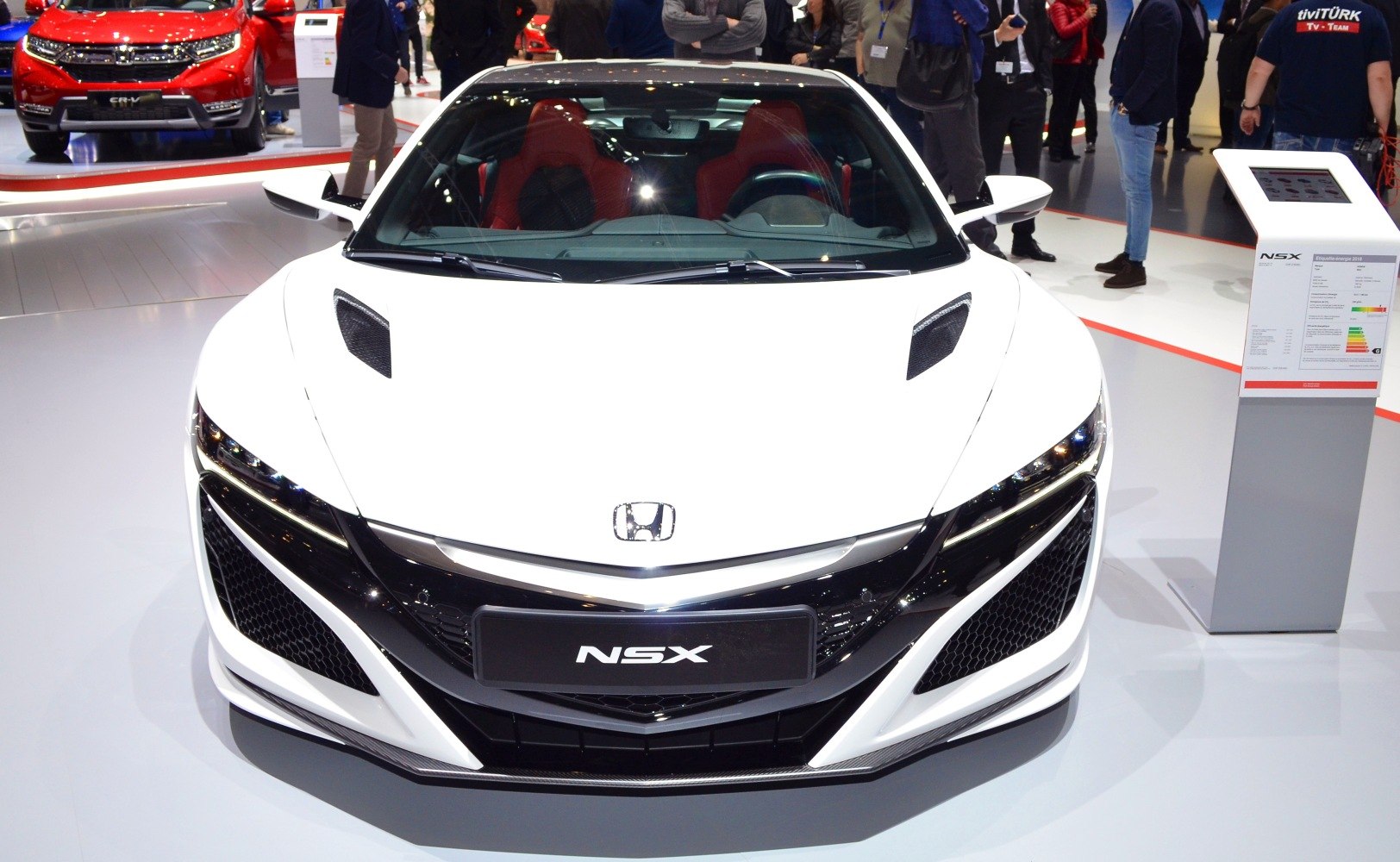 Front view with aerodynamic hood vents and sleek grille