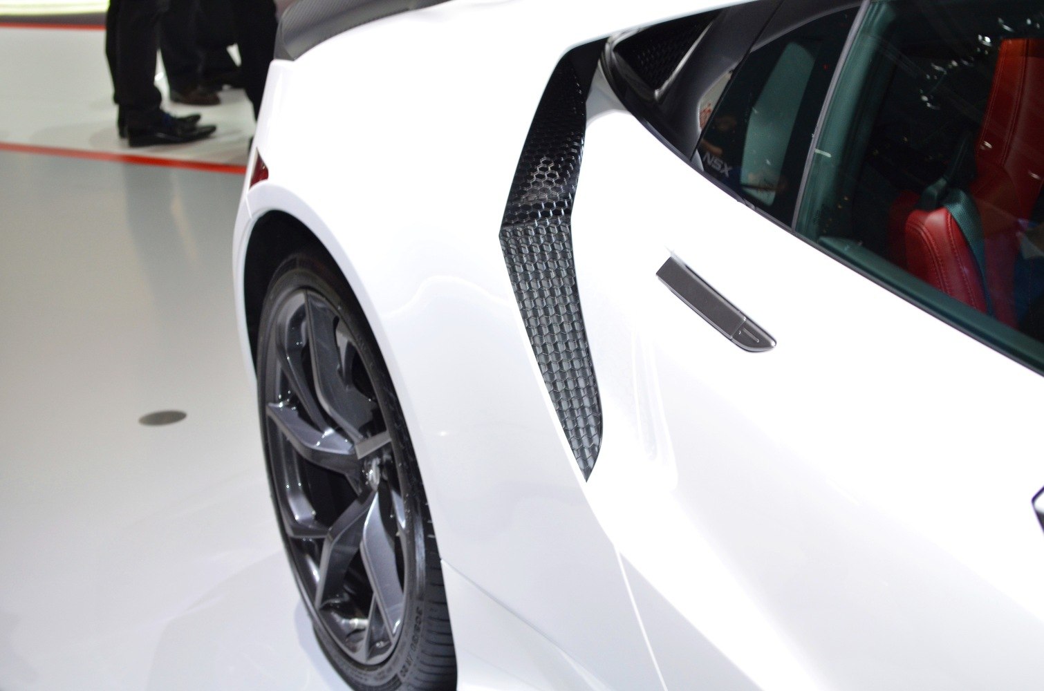 Aerodynamic rear side vent and alloy wheel close-up