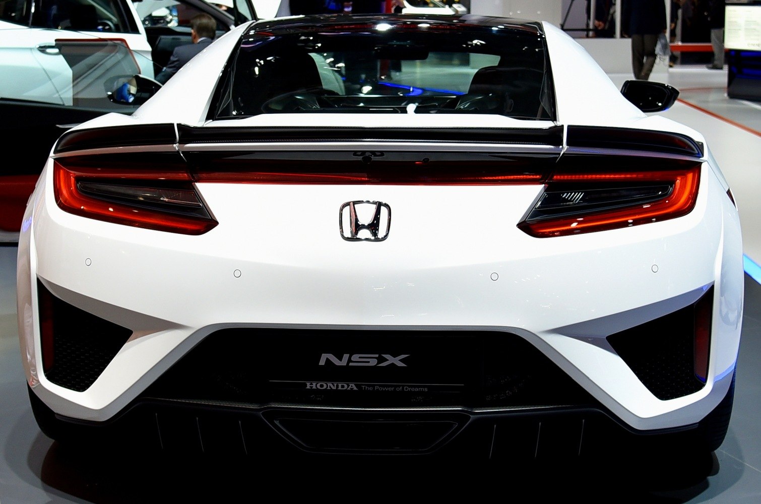 Rear view with distinctive taillights and aerodynamic features
