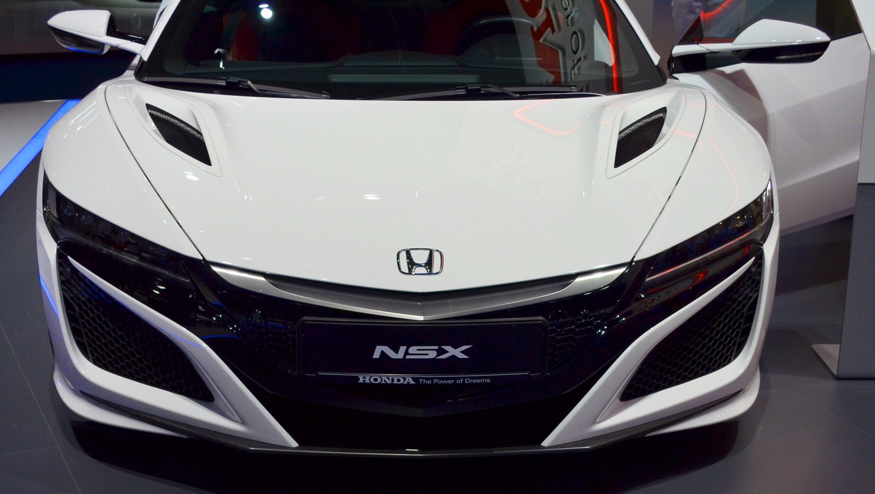 Front view with aerodynamic hood vents and aggressive grille
