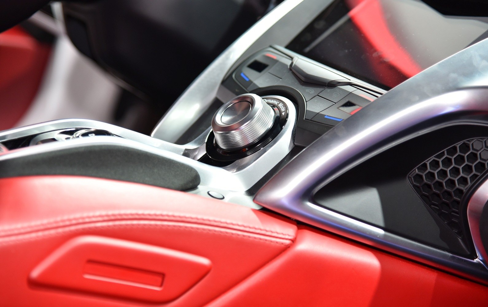Dynamic mode control dial with red leather interior and center console.