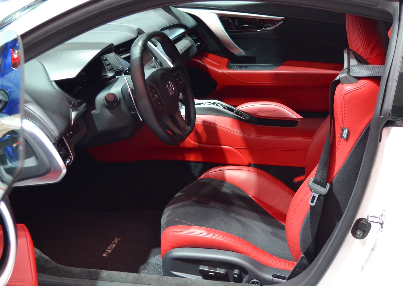 Sporty interior with red and black leather seats and steering wheel