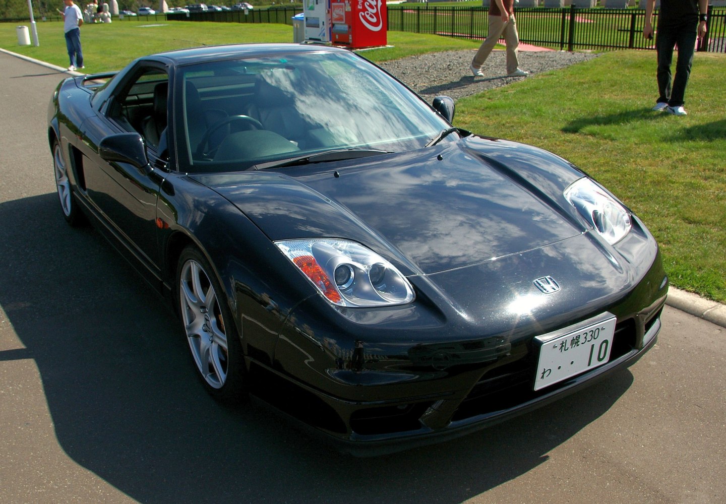 Front exterior with dual projector headlights and aerodynamic body