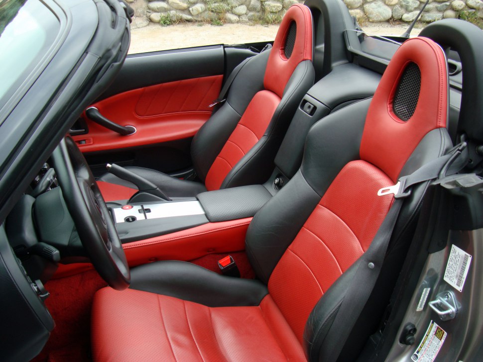 Red and black leather sports seats with modern convertible interior
