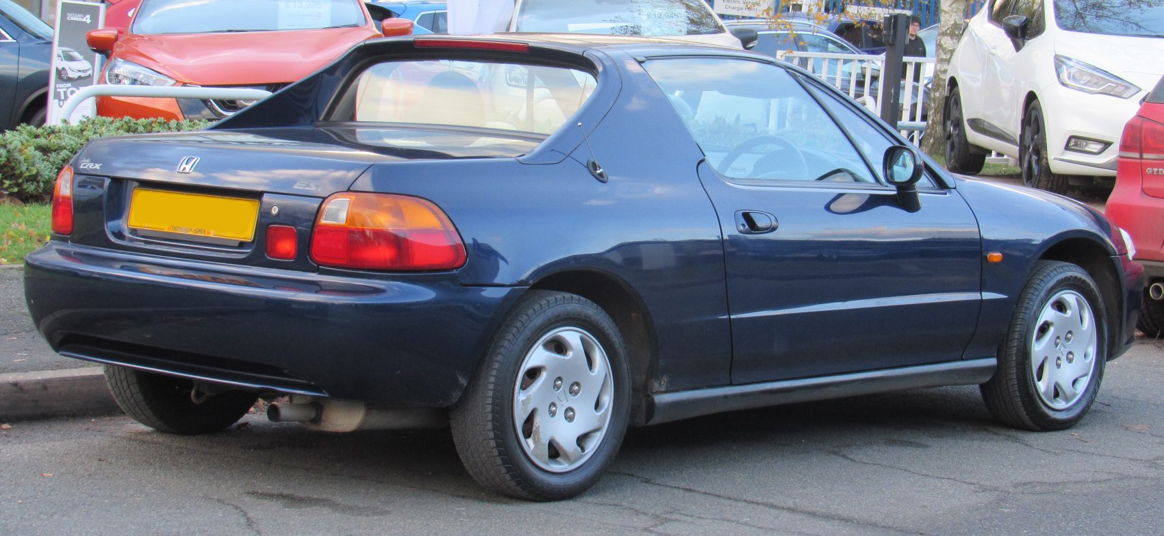 Rear side view of compact sporty hatchback with classic design