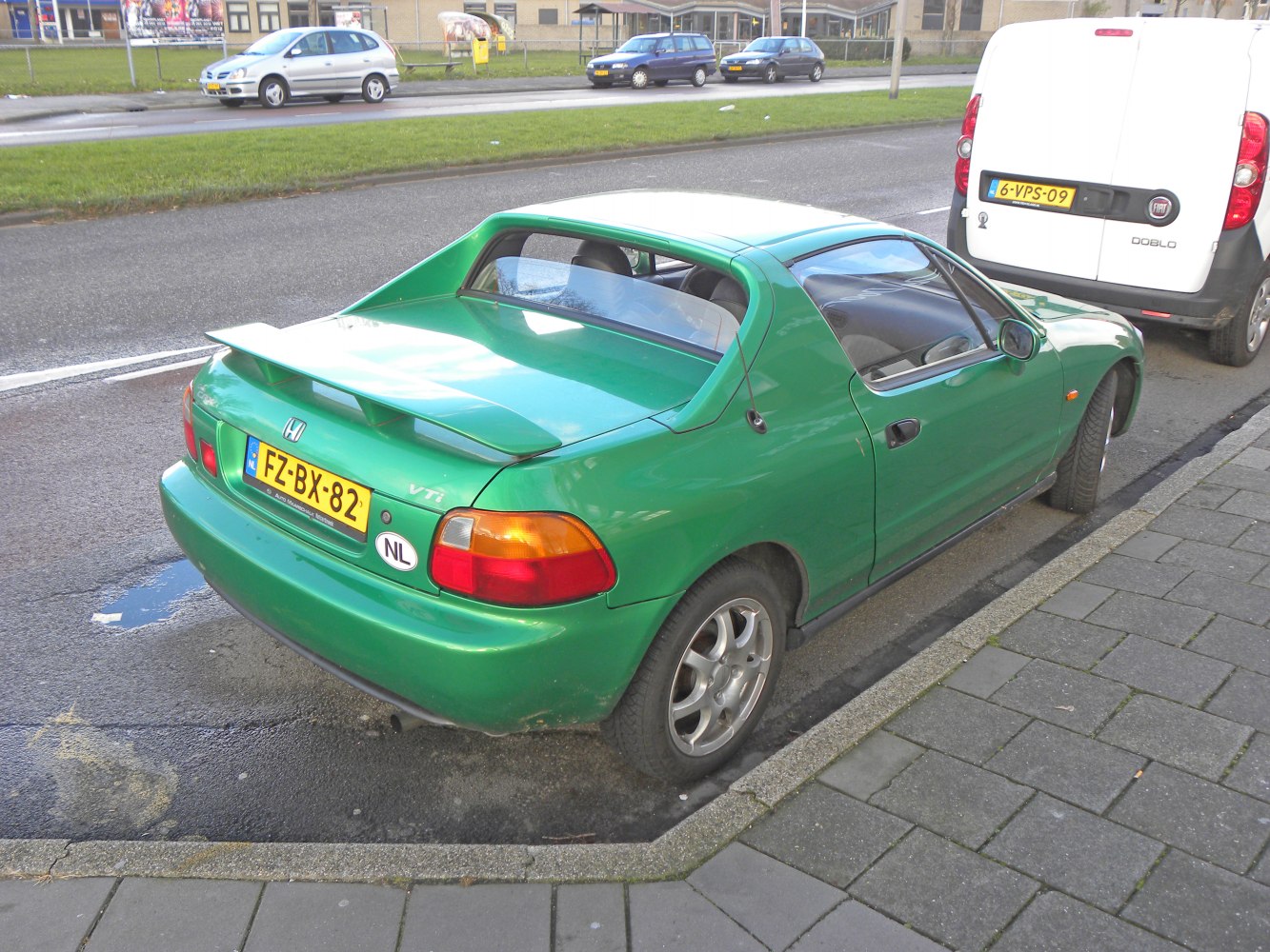 Rear side view with spoiler of compact sporty hatchback