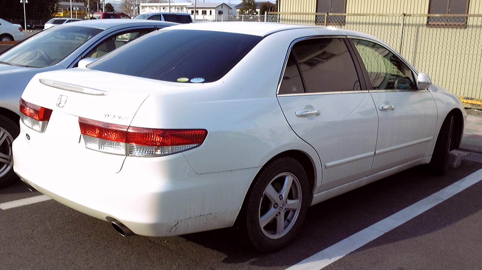 Rear side view with distinctive taillights and five-spoke alloy wheels