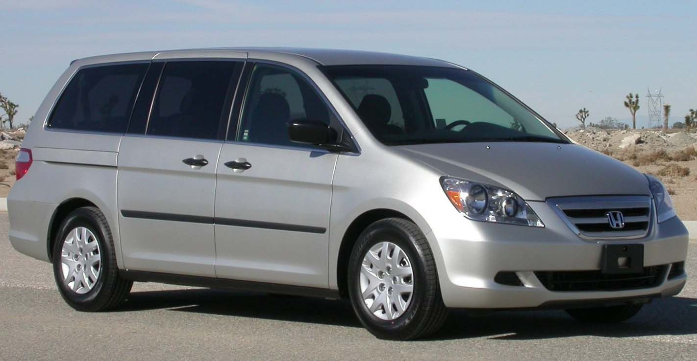 Silver minivan with side sliding doors and front exterior view