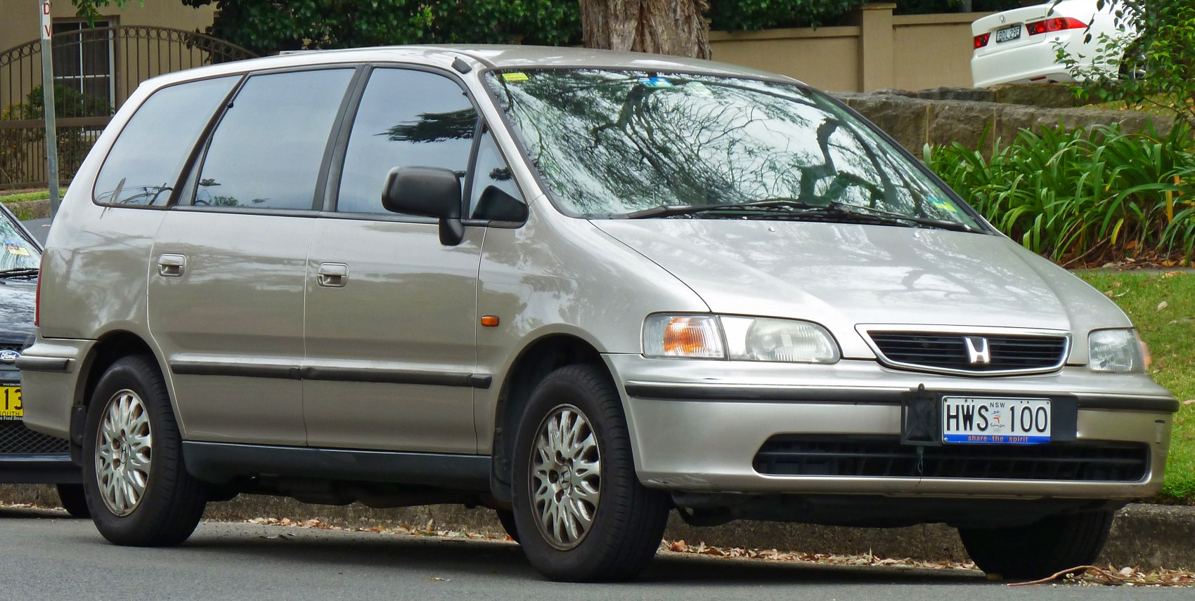Silver minivan with classic front grille and alloy wheels