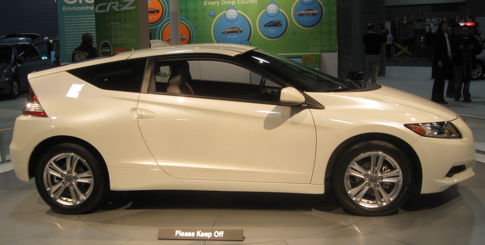Side profile of sporty hatchback with unique rear window design and alloy wheels
