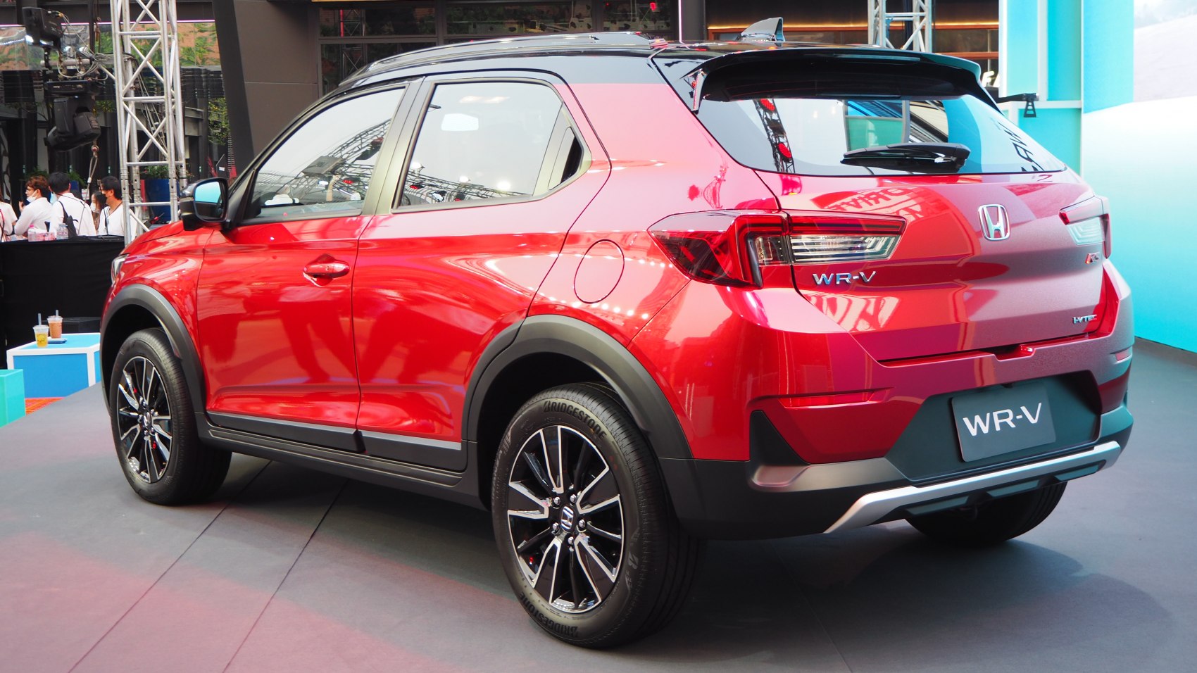 Rear and side view of red compact SUV with modern tail lights and alloy wheels