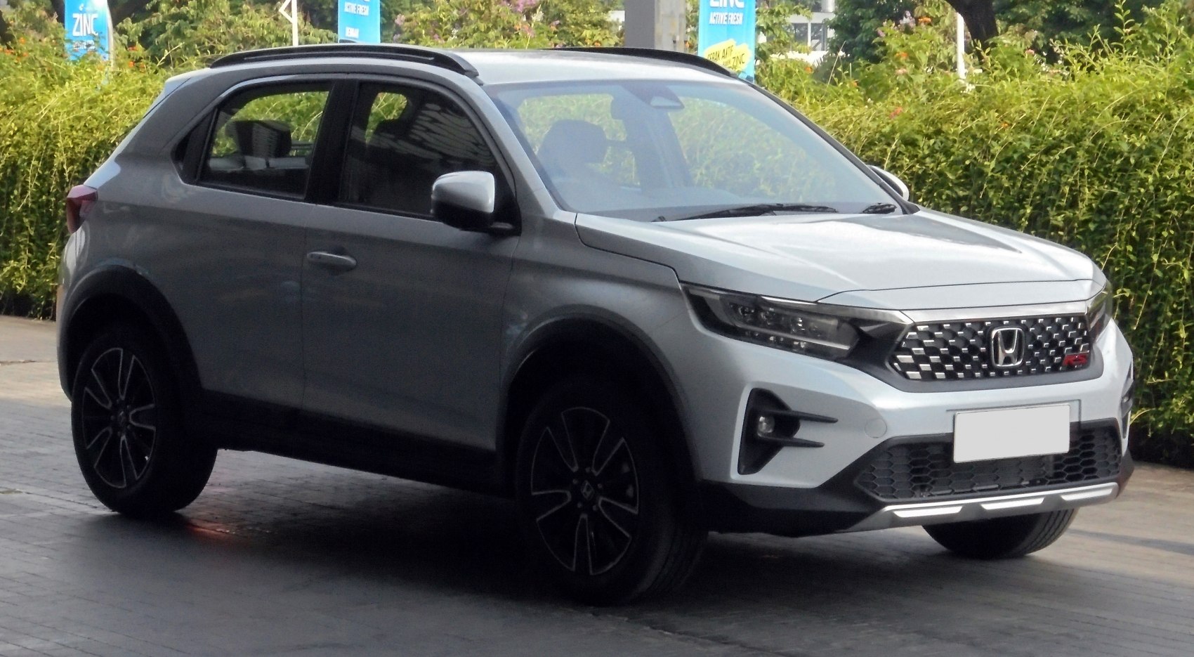 Front side view showcasing LED headlights and alloy wheels on compact SUV