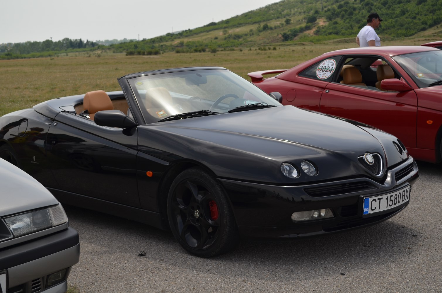 Convertible with dual round headlights and tan seats