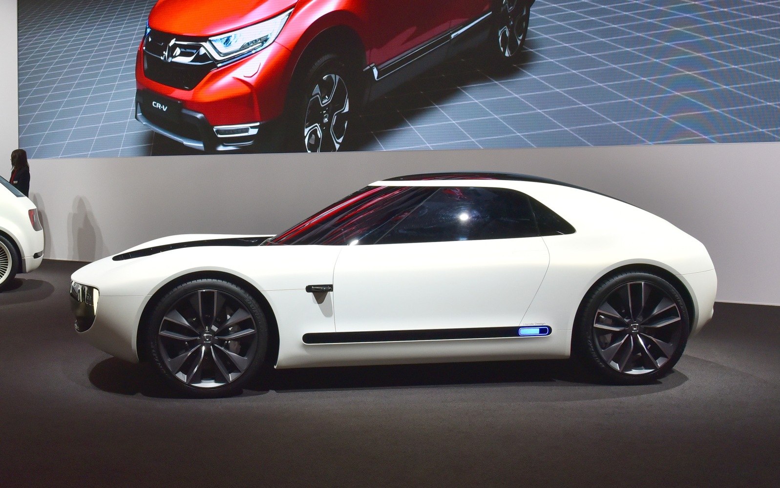 Futuristic sports EV concept with sleek aerodynamic shape and large alloy wheels