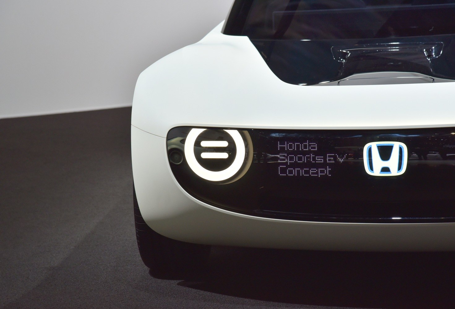 Futuristic front LED headlight and digital badge display