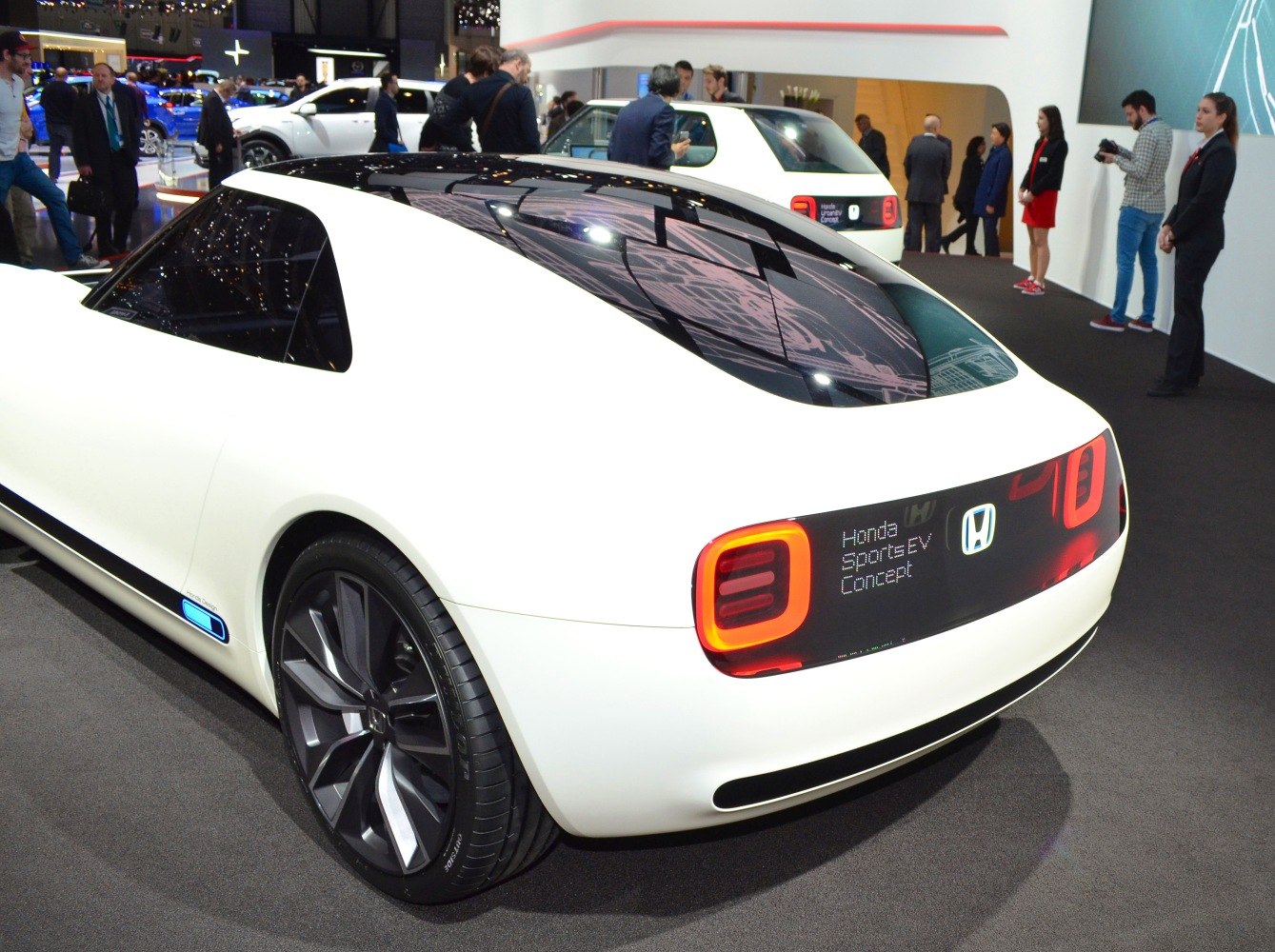 Sleek rear design with futuristic LED taillights and large sporty wheels