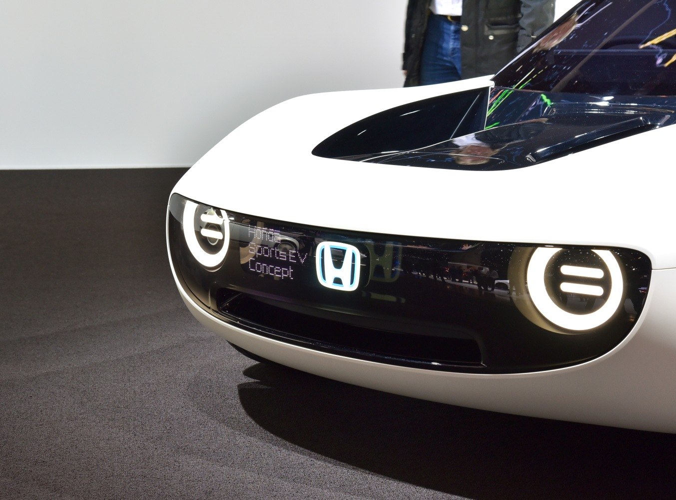 Futuristic front design with LED headlights and illuminated logo
