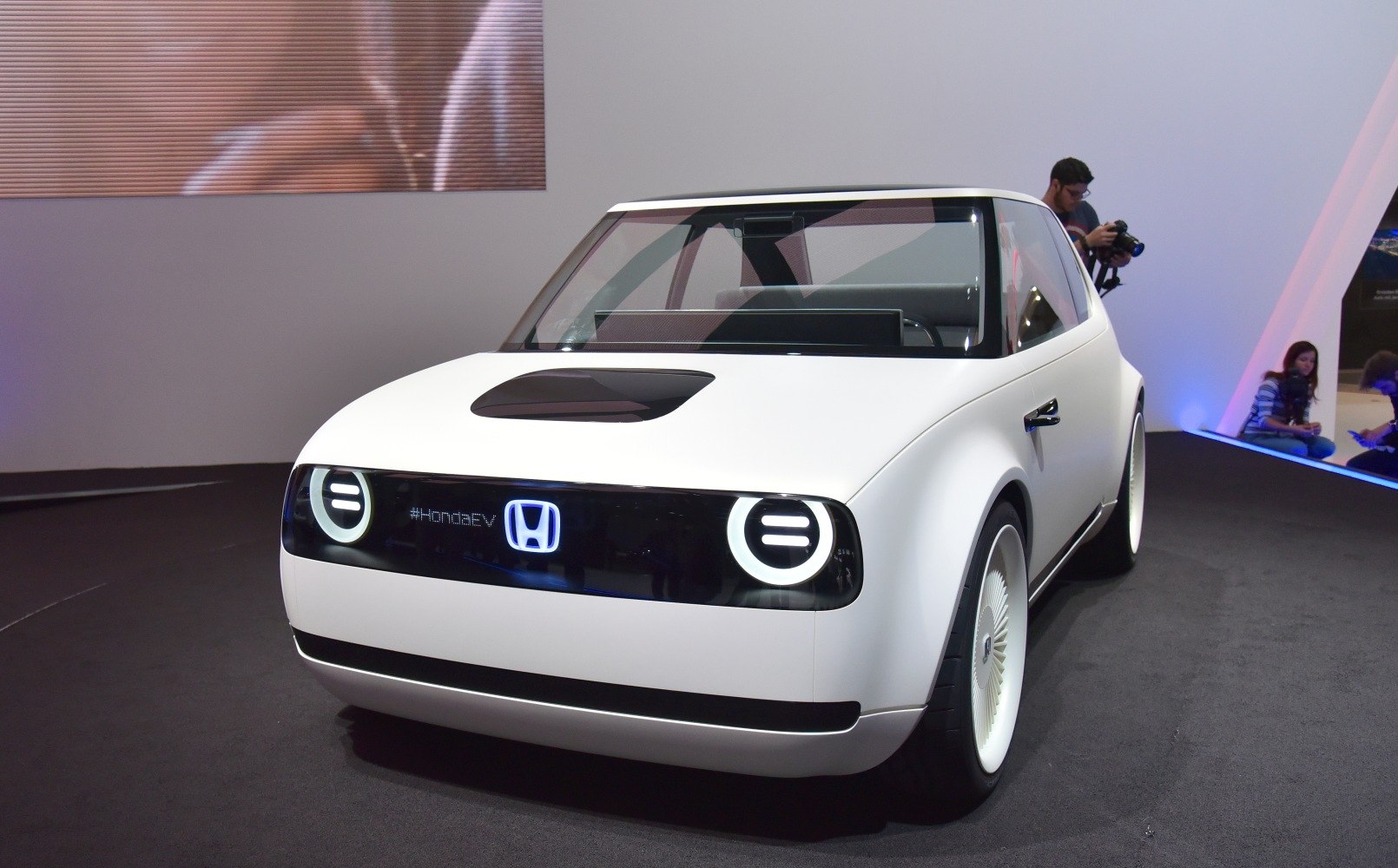 Front view with circular LED headlights and minimalist design