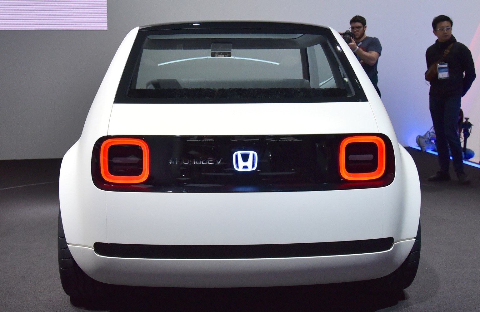 Rear view with rectangular LED tail lights and Honda emblem on black panel