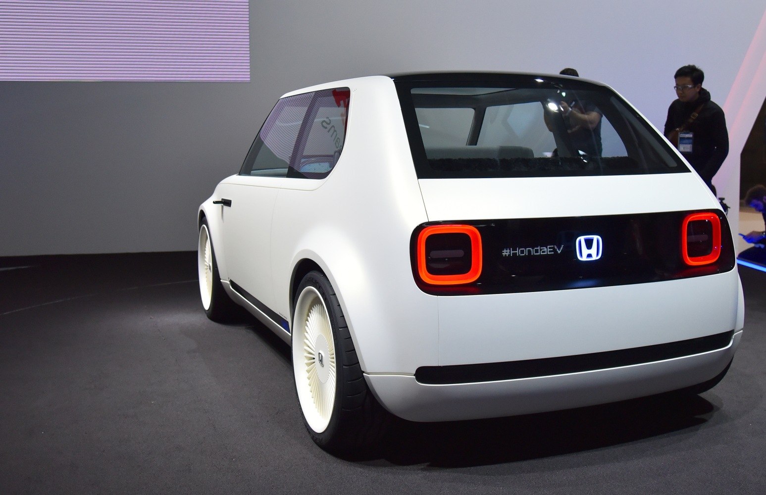 Rear and side view with square tail lights and retro-modern compact styling
