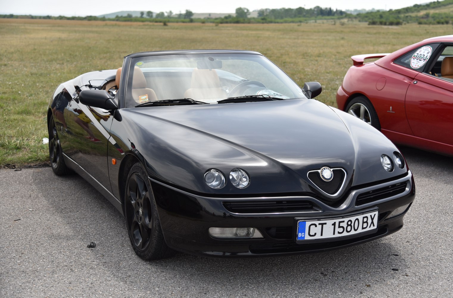 Front view of convertible with dual round headlights and aerodynamic shape