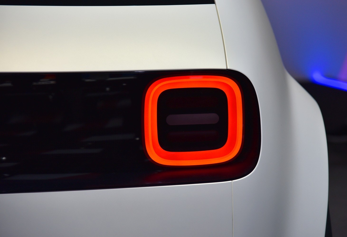 Close-up of a modern rectangular LED rear tail light with rounded corners.