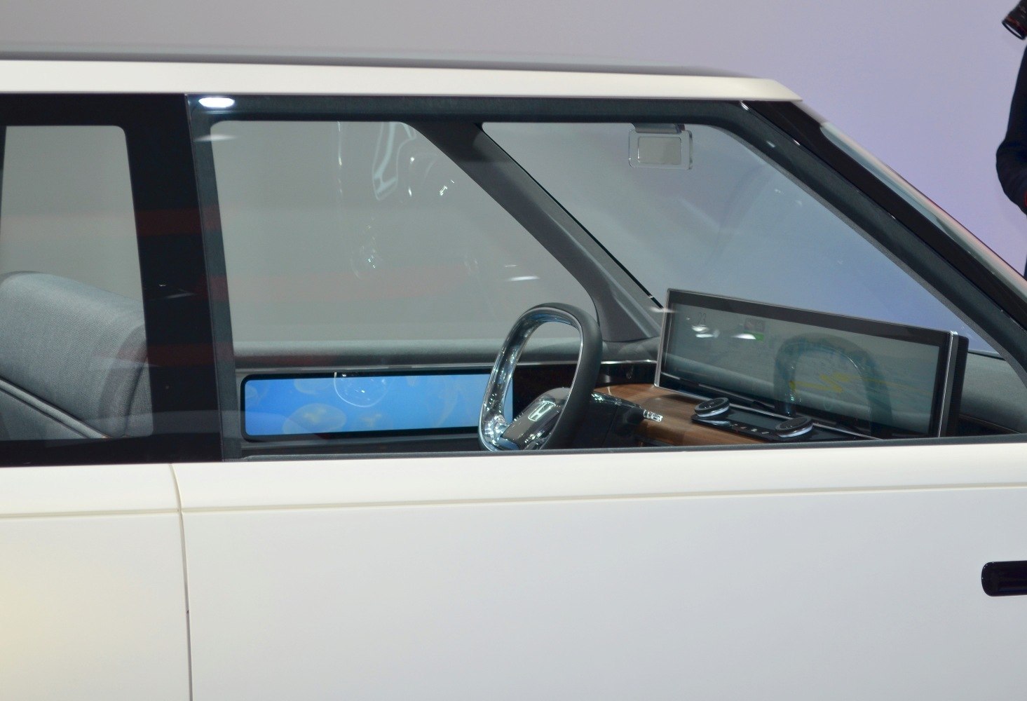 Futuristic digital dashboard and compact steering wheel inside car