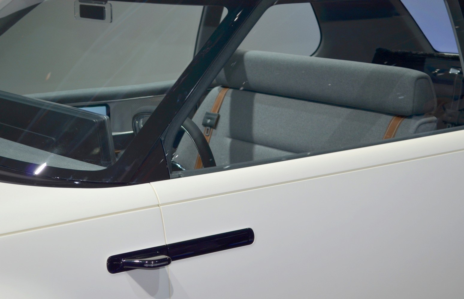 Minimalistic grey interior with modern black door handle